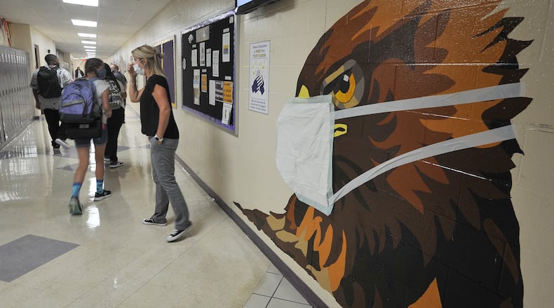 Bellbrook High School's Eagle mascot is decorated with a mask during classes earlier this fall. MARSHALL GORBY\STAFF