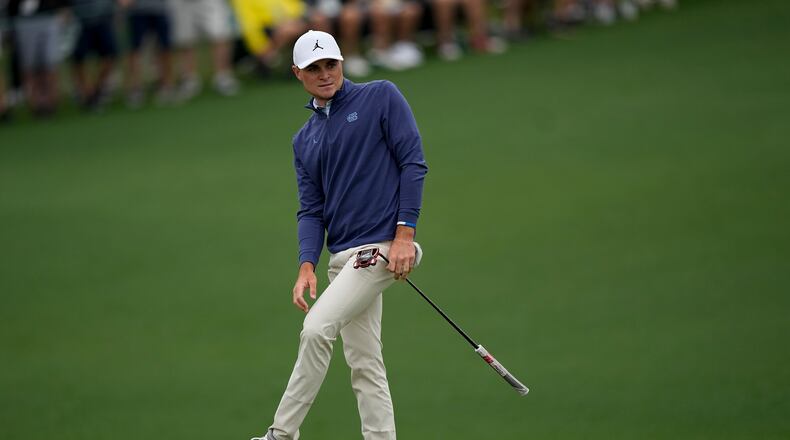 Amateur, Austin Greaser reacts after missing a putt for eagle on the second hole during the first round at the Masters golf tournament on Thursday, April 7, 2022, in Augusta, Ga. (AP Photo/David J. Phillip)