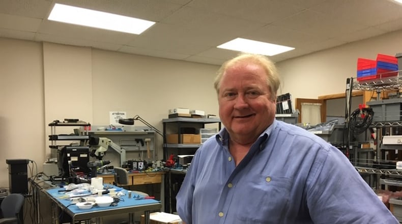 Bob Appenzeller, chief technology officer of Centerville defense contractor Dragoon ITCN, in his natural environment, an equipment lab. THOMAS GNAU/STAFF