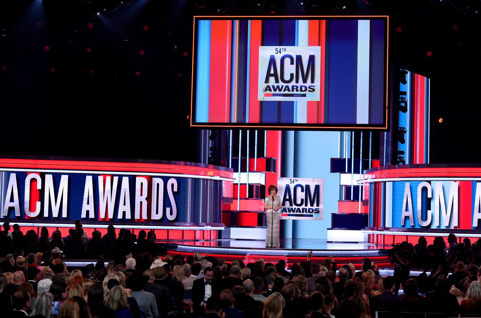 FILE - Host Reba McEntire appears on stage at the 54th annual Academy of Country Music Awards in Las Vegas on April 7, 2019. (Photo by Chris Pizzello/Invision/AP, File)