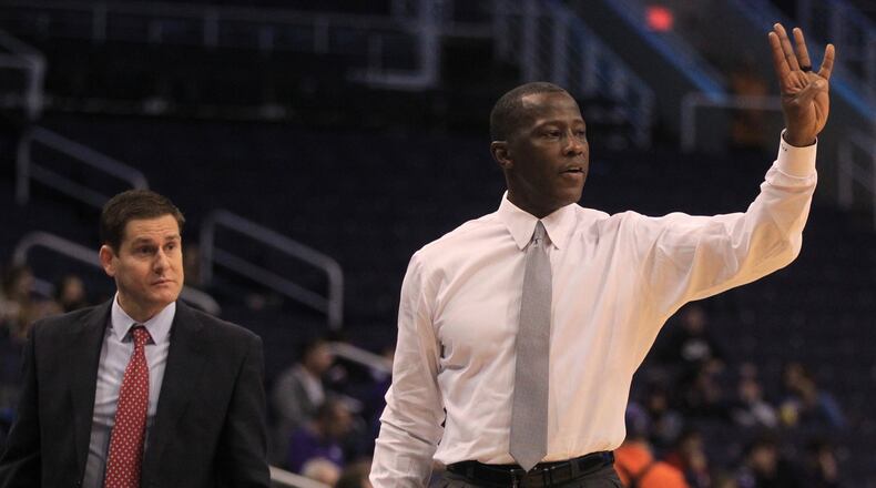 Dayton’s Anthony Grant coaches during a game against Saint Mary’s on Sunday, Dec. 8, 2019, at Talking Stick Resort Arena in Phoenix, Ariz. At left is assistant coach Darren Hertz. David Jablonski/Staff