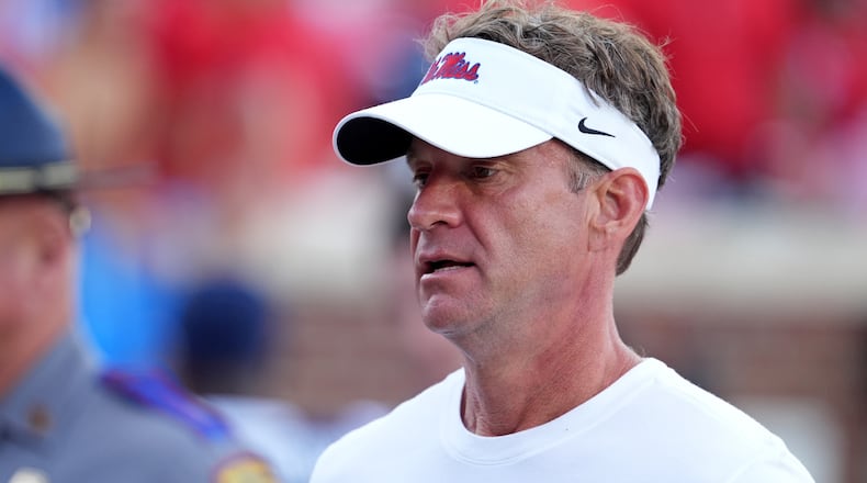 Mississippi head coach Lane Kiffin leave the field following an NCAA college football game against The Citadel, Saturday, Nov. 8, 2025, in Oxford, Miss. (AP Photo/Rogelio V. Solis)