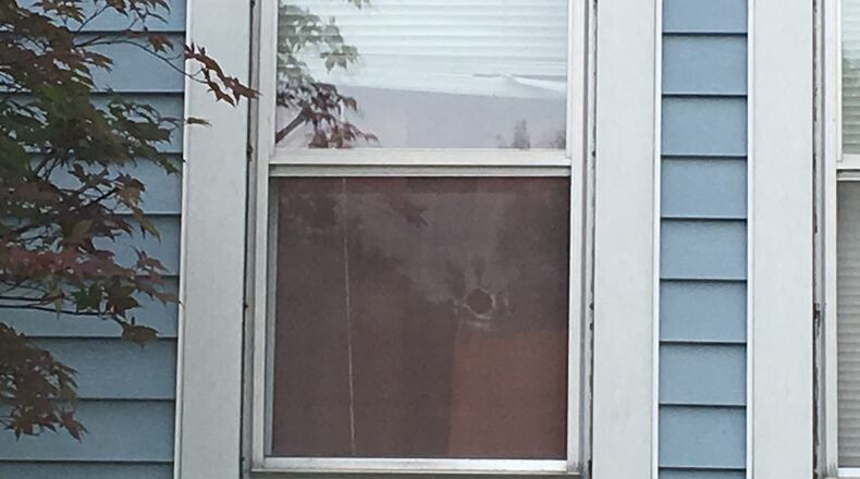 There’s a hole in a front window of the home on Morse Avenue where Mackenna Kronenberger died early Wednesday morning. MIKE CAMPBELL/STAFF