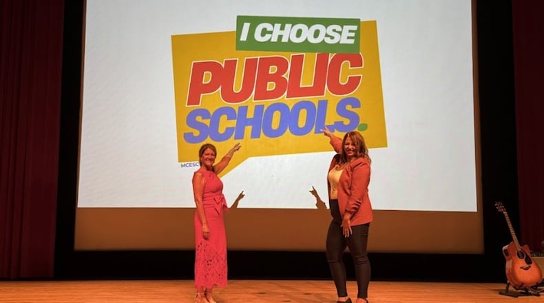 MCESC Superintendent Shannon Cox and Assistant Superintendent Amy Anyanwu unveil the I Choose Public Schools campaign logo during the 2025 MCESC Administrators’ Day. CONTRIBUTED