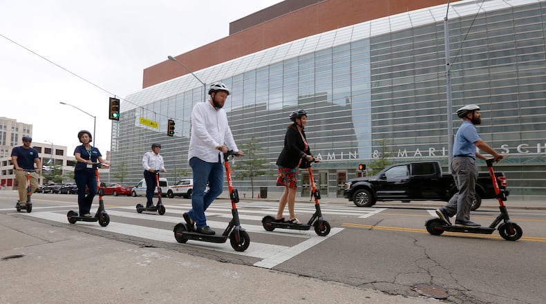 Greater Dayton RTA held a launch party to introduce scooters to the city of Dayton. Spin Electric Scooters were available for test rides at Courthouse Square on Wednesday. Dayton residents, civic leaders, Dayton Police and Fire Department members rode the scooters a few blocks around downtown Dayton. The group rides east on Second Street. TY GREENLEES / STAFF
