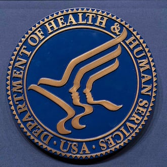 FILE = The Health and Human Services seal is seen before the news conference of Secretary Robert F. Kennedy Jr. at the Hubert Humphrey Building Auditorium in Washington, Wednesday, April 16, 2025. (AP Photo/Jose Luis Magana, File)