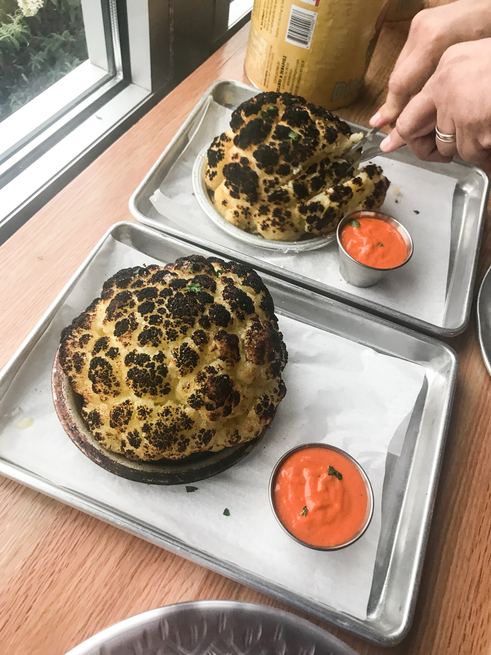 Old Scratch Pizza is offering free pizzas to guest who text "OSP" to 797979 on its first anniversary, Oct. 18, 2017. Old Scratch has sold more than 6,000 heads of roasted cauliflower since opening.