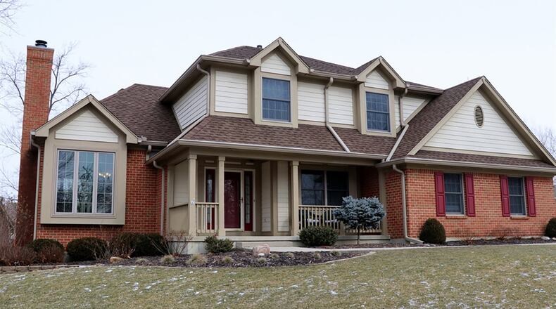 The 4-bedroom, brick-and-plank home has about 3,270 sq. ft. of living space, including the finished lower level. The house sits on a corner lot and has a wooden privacy fence and side-entry, 2-car garage. CONTRIBUTED PHOTOS BY KATHY TYLER