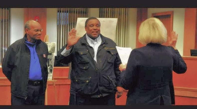 New Piqua Mayor Kris Lee, center, receives the oath of office earlier this month from retired Miami County Judge Elizabeth Gutmann while Larry Hamilton, left, looks on. CONTRIBUTED