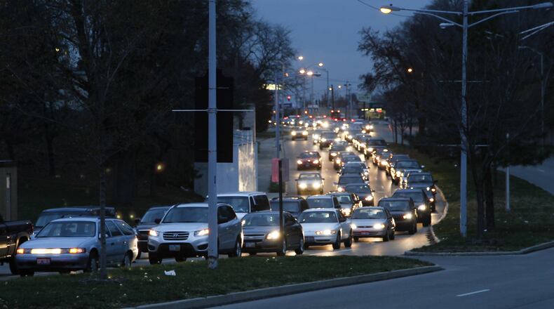 Montgomery County drivers could pay more if an additional $5 tax is approved. A state law changed to allow the additional fee, which would generate about $2 million for local roads and bridges. Here, drivers find themselves in a crawl all the way from downtown to the Edwin C. Moses Boulevard interchange. CHRIS STEWART / STAFF