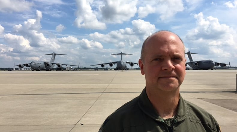 Lt. Col. Steven R. Shrader, 445th Airlift Wing deputy group operations commander, stands on the flight line Thursday in front of three C-17 jets based at Wright-Patterson Air Force Base. Wright-Patterson C-17s have been called into Hurricane Harvey relief efforts in Texas. BARRIE BARBER/STAFF