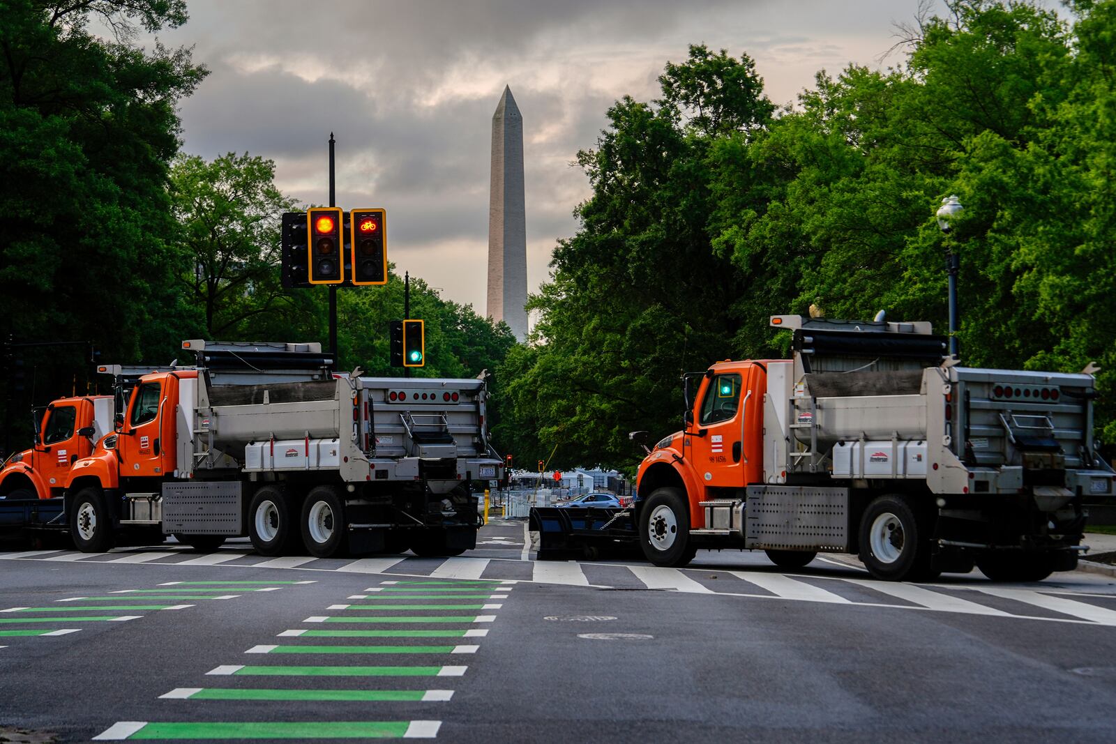 The Washington Monument is seen as dump trucks block an intersection ahead of an upcoming military parade commemorating the U.S. Army's 250th anniversary and coinciding with President Donald Trump's 79th birthday, Saturday, June 14, 2025, in Washington (AP Photo/Julia Demaree Nikhinson)