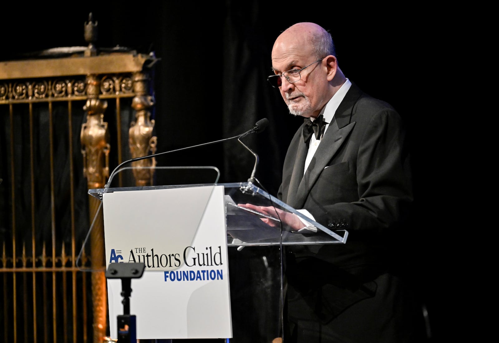Salman Rushdie accepts the champion of writers award at the Authors Guild Foundation Dinner at Gotham Hall on Monday, April 7, 2025, in New York. (Photo by Evan Agostini/Invision/AP)