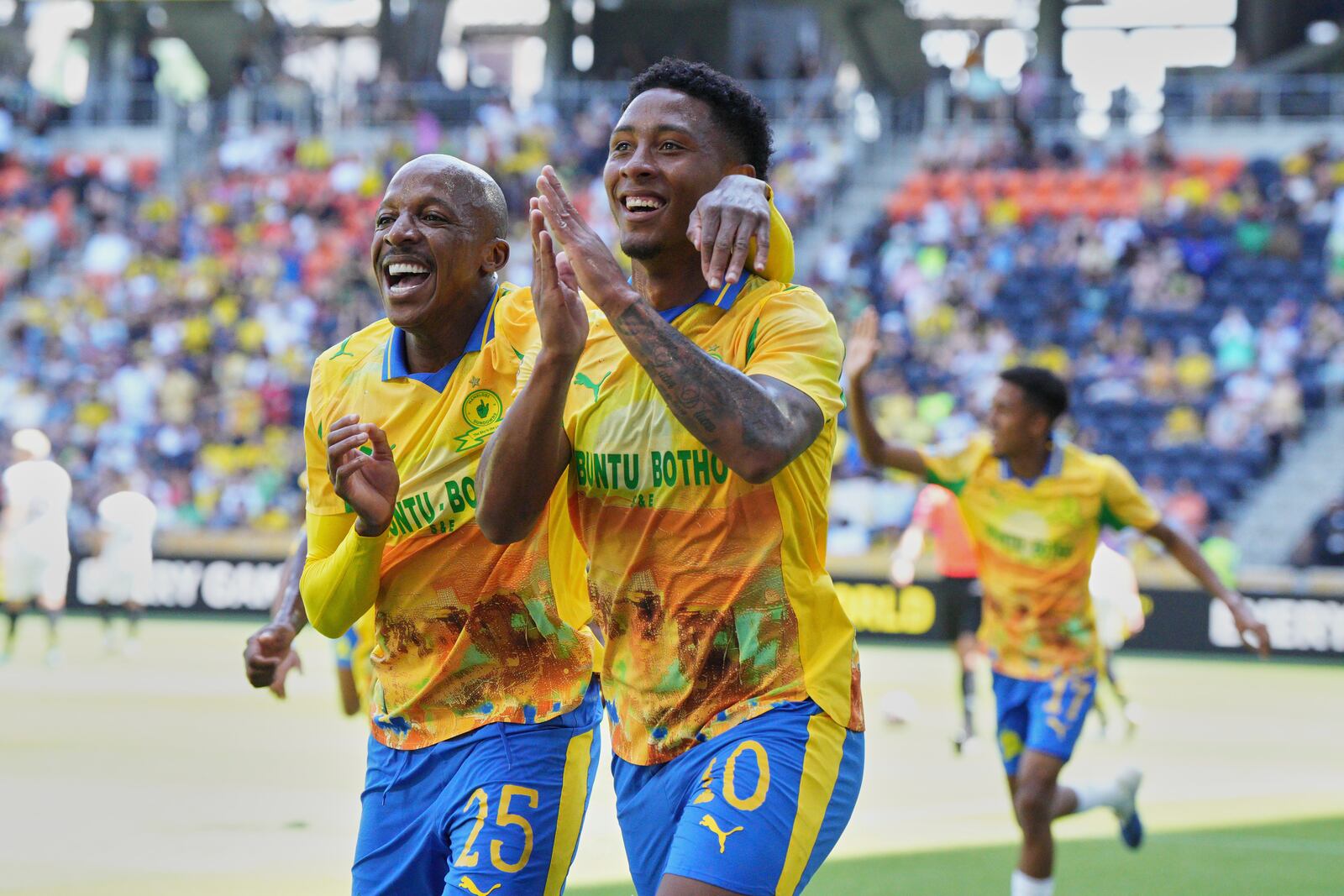 Mamelodi Sundowns' Khuliso Mudau, left, and Lucas Ribeiro Costa celebrate after a goal during the Club World Cup Group F soccer match between Mamelodi Sundowns and Borussia Dortmund in Cincinnati, Saturday, June 21, 2025. (AP Photo/Jeff Dean)