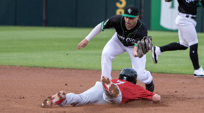 Dayton second baseman Sal Stewart tags out Fort Wayne's Lucas Dunn on a throw from catcher Logan Tanner during Tuesday night's game at Day Air Ballpark. Jeff Gilbert/CONTRIBUTED