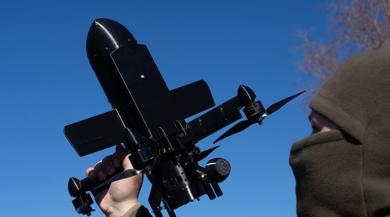 An instructor from the Ukrainian company General Cherry demonstrates the operation of an anti-air interceptor drone designed to destroy Russian attack drones in Kyiv region, Wednesday, March 11, 2026. (AP Photo/Efrem Lukatsky)