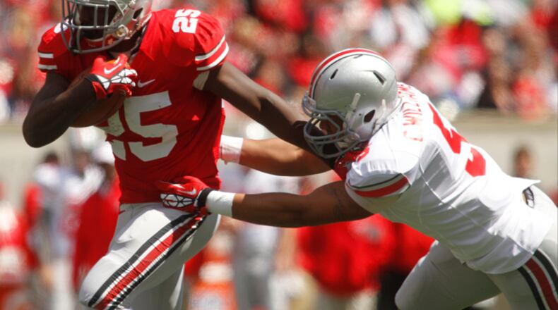Bri'onte Dunn (25) of the Scarlet Team is pursued Camren Williams (5) of the Gray Team during the Ohio State Football 2013 Spring Game on Saturday, April 13, 2013, at Paul Brown Stadium in Cincinnati. Barbara J. Perenic/Staff