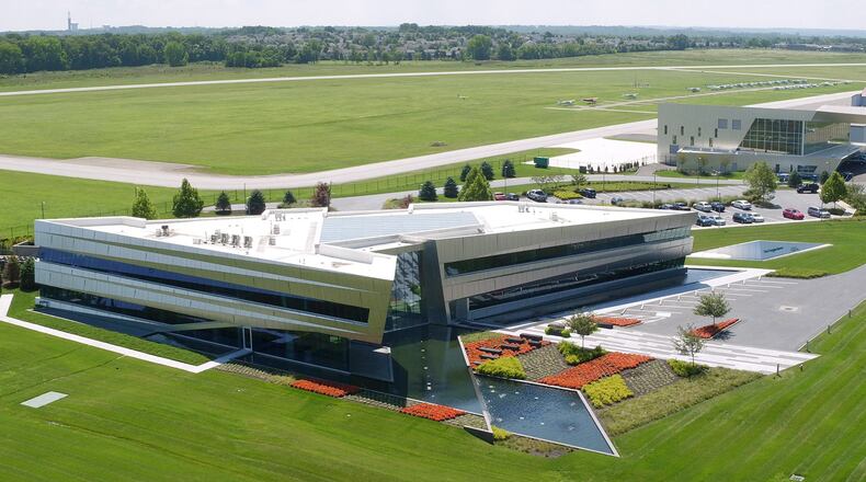 The Connor Group’s headquarters and hangar to its right at the Dayton-Wright Brothers Airport in Miami Twp. combine for more than $20 million in development at the facility. TY GREENLEES / STAFF