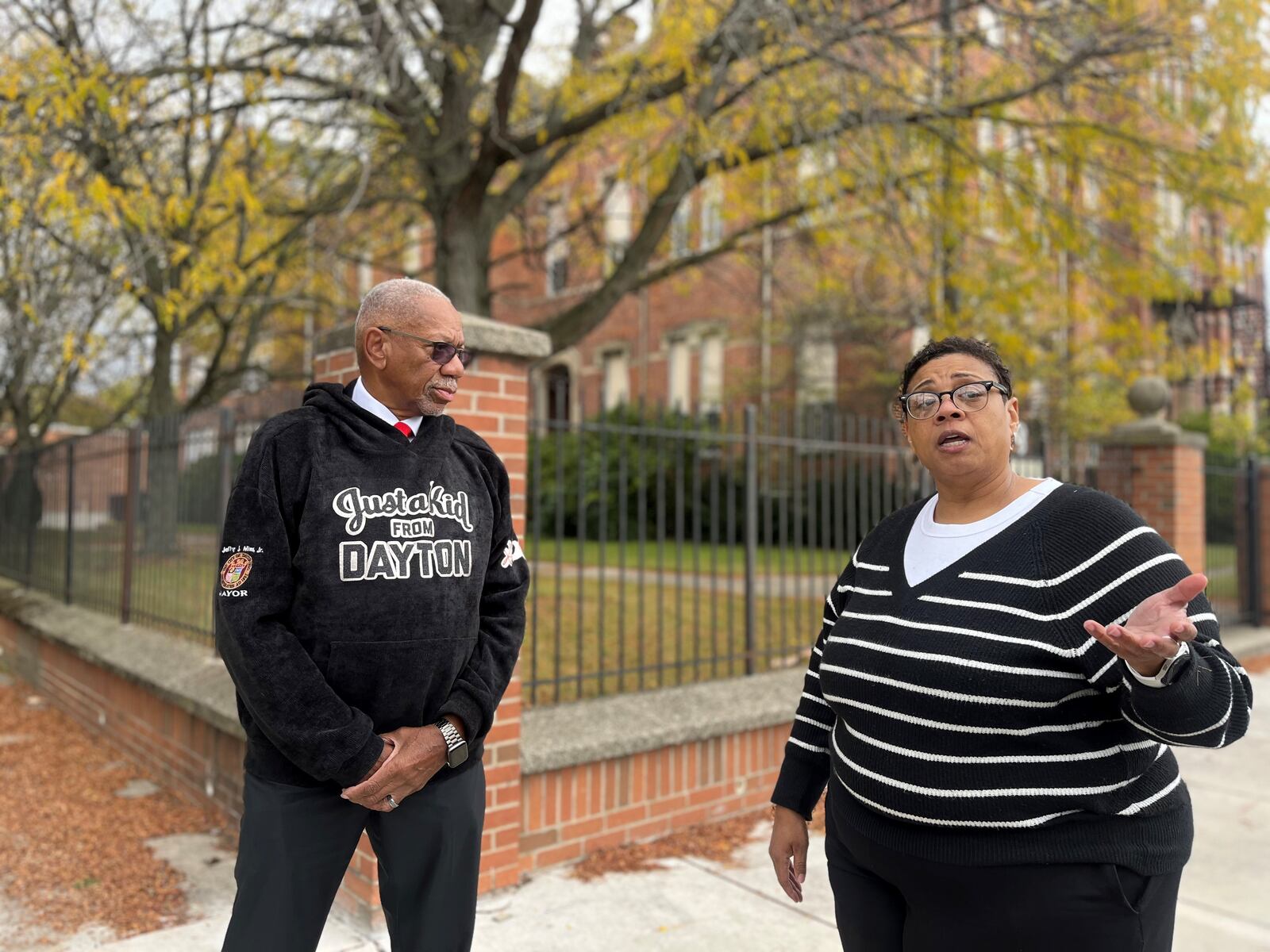 Dayton Mayor Jeffrey Mims Jr. and Veronica Morris, the city's economic development supervisor, discuss some of the major projects and investments going on around the city outside of the Longfellow school campus along Salem Avenue. The school property is going to be converted into housing and new amenities. CORNELIUS FROLIK / STAFF