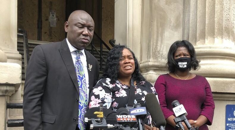 Tamika Palmer, mother of Breonna Taylor, addresses the media in Louisville, Ky. on Thursday, Aug. 13, 2020. Five months after her daughter was shot to death by police, Palmer said she is trying to be patient while waiting to hear if the officers will be charged. (AP Photo/Dylan Lovan)