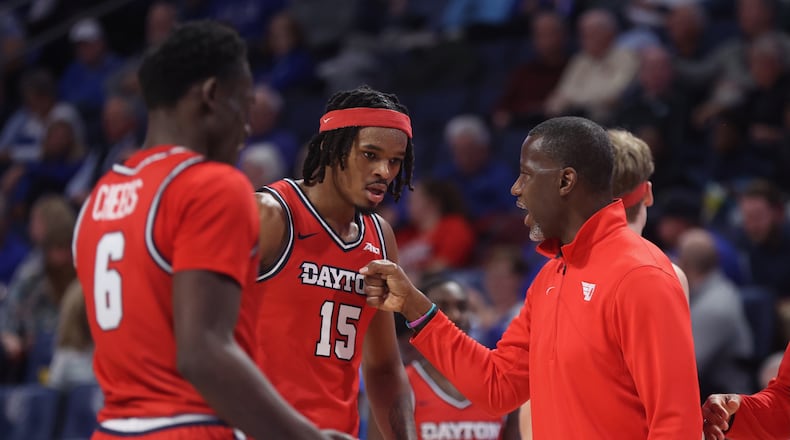 Dayton's Anthony Grant talks to DaRon Holmes II during a game against Saint Louis on Tuesday, March 5, 2024, at Chaifetz Arena in St. Louis, Mo. David Jablonski/Staff