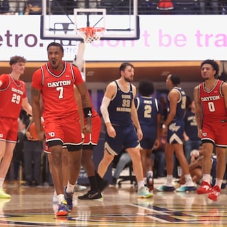 Dayton's Keonte Jones celebrates after a defensive stop in the final seconds against George Washington on Friday, Feb. 27, 2026, at the Charles E. Smith Center in Washington, D.C. David Jablonski/Staff