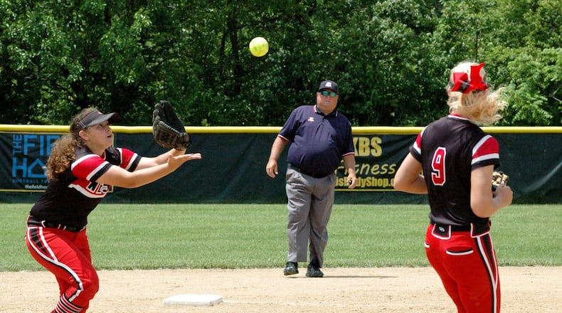 Lakota West shortstop Ariah Peregrina catches a popup in front of teammate Alyssa Triner  during a Division I regional championship softball game against Lakota East at Centerville in 2019. FILE PHOTO