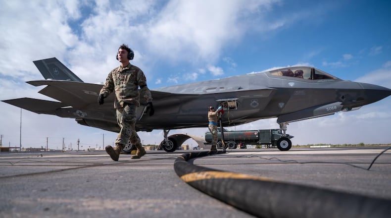 U.S. Air Force 62nd Aircraft Maintenance Unit crew chiefs refuel an F-35 Lightning II, Nov. 3, 2022, at Gila Bend Air Force Auxiliary Field, Arizona.  (U.S. Air Force photo by Airman Mason Hargrove)