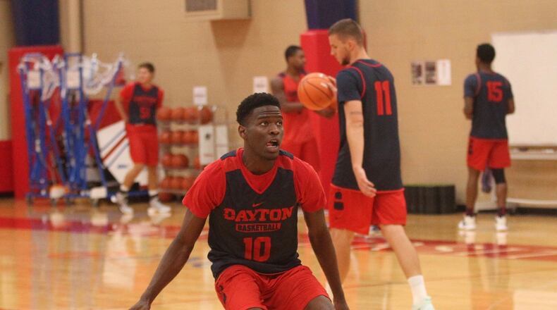 Dayton’s Jalen Crutcher warms up before an individual skill instruction workout on Thursday, Sept. 21, 2017, at the Cronin Center. David Jablonski/Staff