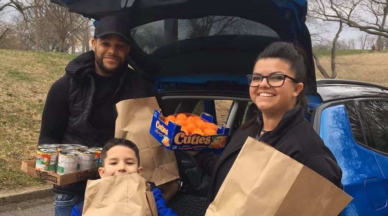 Connor Group employee Keri Stafford (right) helps with recent grocery donations. CONTRIBUTED PHOTO