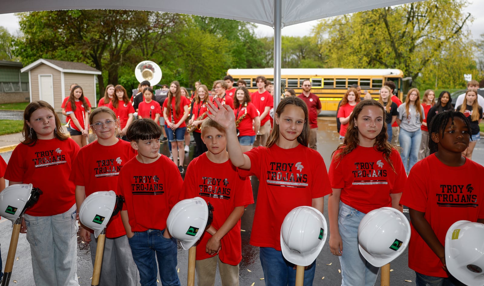 A young student get acknowledged by attendees during a groundbreaking of three new elementaries and one intermediate school within Troy City Schools on Thursday, May 1, 2025, at Hook Elementary School. JOSEPH COOKE/STAFF