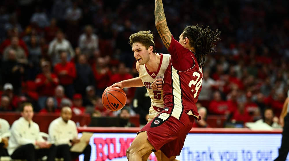 Miami's Pete Suder drives past a UMass defender during the RedHawks 86-84 victory in Mid-American Conference action on Tuesday, January 27, 2026 at Millett Hall in Oxford. JEREMY MILLER / CONTRIBUTED PHOTO