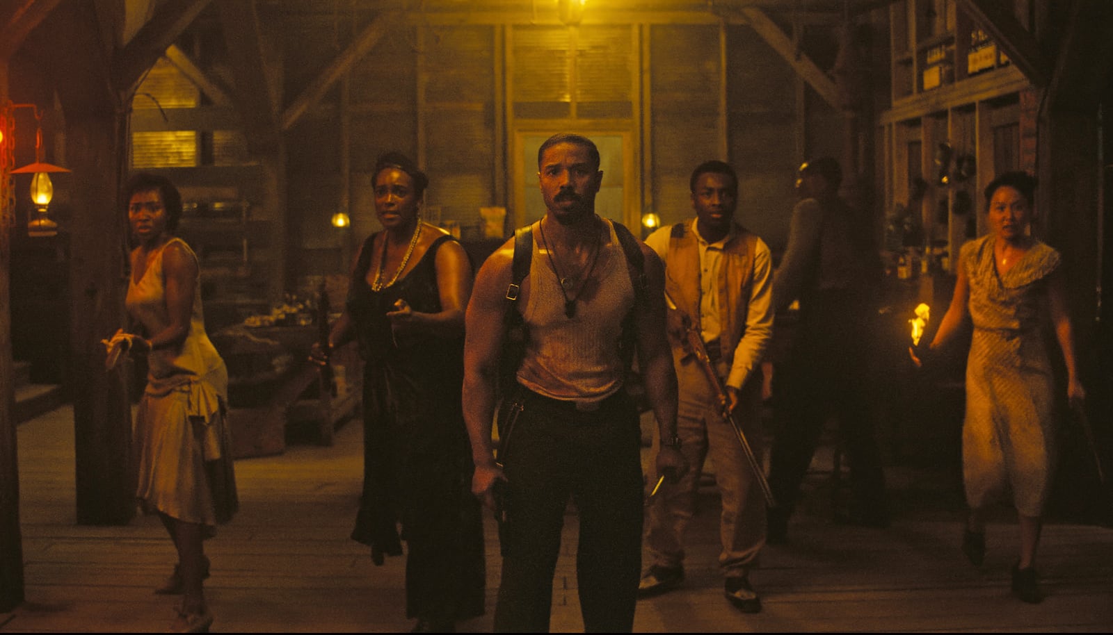 This image released by Warner Bros Pictures shows Michael B. Jordan, center, in a scene from "Sinners." (Warner Bros. Pictures via AP)