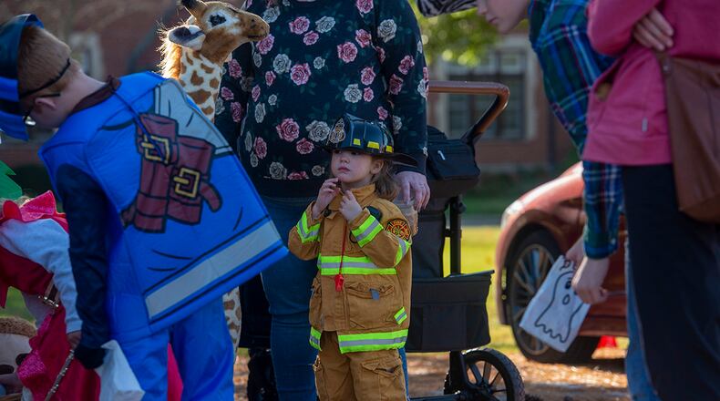 Lynnex Willis, dressed in a firefighter costume, participates in the Great Pumpkin Off and “Trunk or Treat” event Oct. 21 at Wright-Patterson Air Force Base. The gathering featured several base organizations passing out candy to children and activities for families to enjoy. U.S. AIR FORCE PHOTO/SENIOR AIRMAN JACK GARDNER
