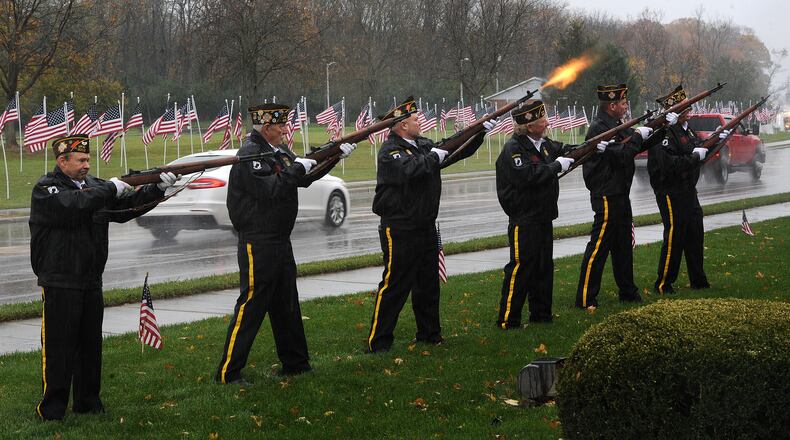 Over 100 people endured the cold rainy weather Thursday Nov. 11, 2021 to attend the Veterans Day ceremony in Beavercreek. MARSHALL GORBY\STAFF