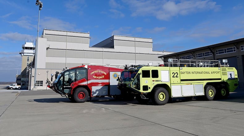 A yellow aircraft-rescue firefighting vehicle belonging to the City of Dayton Airport Fire Department is parked alongside other Wright-Patterson AFB Fire Department vehicles Dec. 8. Dayton loaned the ARFV to the 788th Civil Engineer Squadron when two of its firefighting vehicles went out of service due to mechanical problems. U.S. AIR FORCE PHOTO/TY GREENLEES