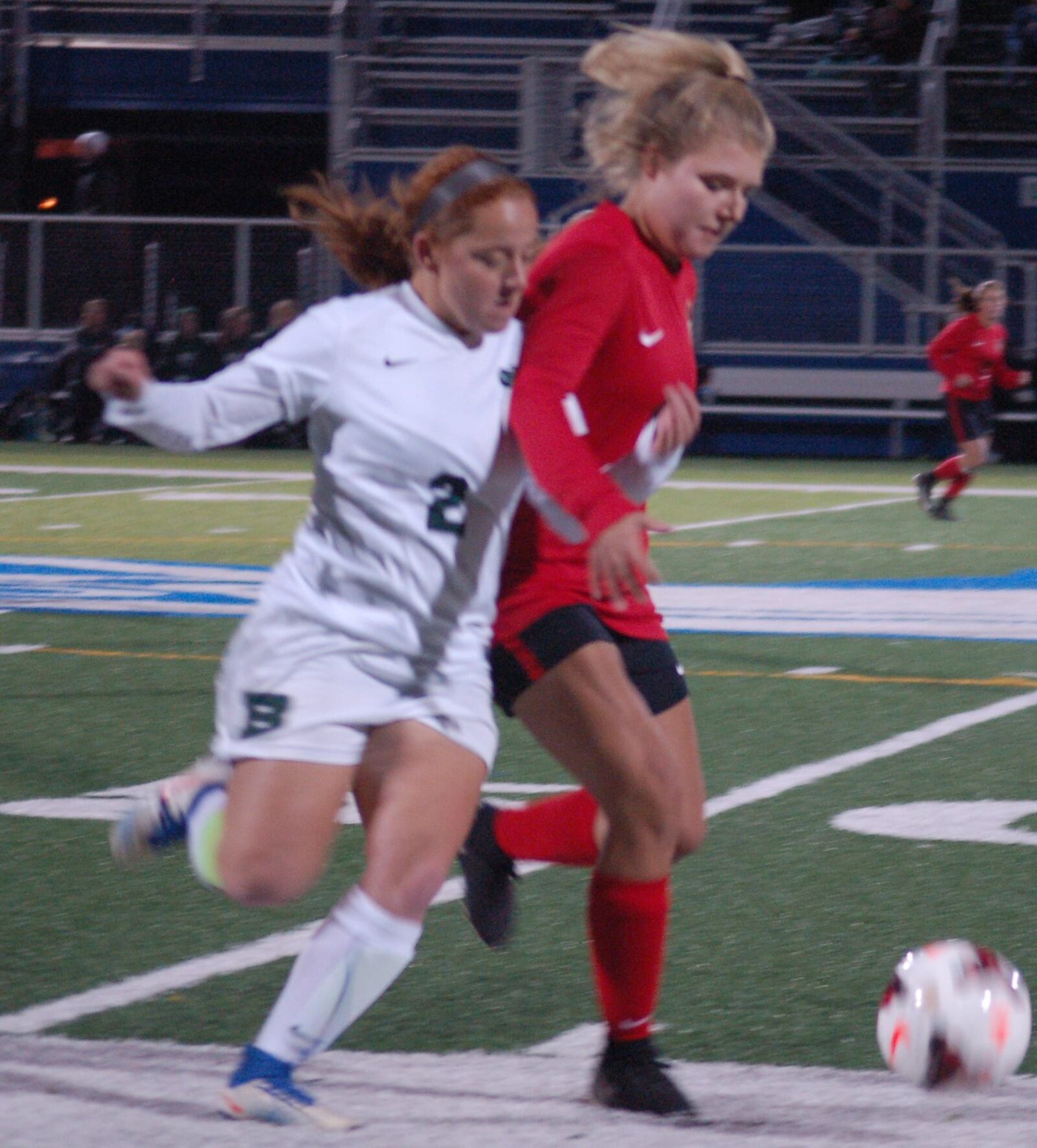 Badin’s Maddie Maccio (2) battles a Tippecanoe player for the ball during their Division II regional semifinal Tuesday night at Chaminade Julienne’s Roger Glass Stadium. CONTRIBUTED PHOTO BY JOHN CUMMINGS