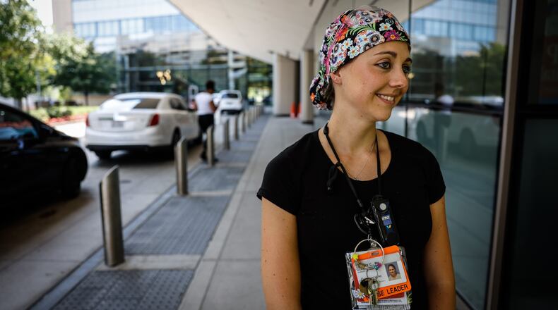 “We’ve already opened up a second 
Lindsey Call is an ICU nurse at Miami Valley Hospital. “We’re on the verge of opening a third. So that just tells you the increase in numbers just in this past week or two. JIM NOELKER/STAFF