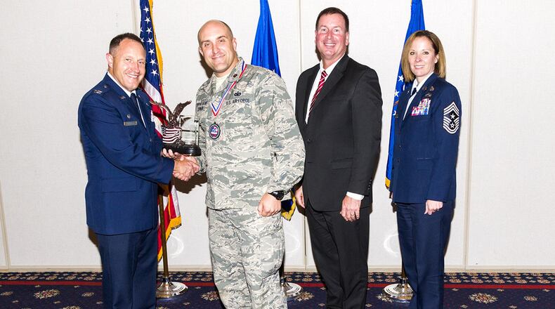Maj. Todd J. Turner was recently awarded the Air Force Office of Special Investigations Individual Mobilization Augmentee of the Year award. Pictured left to right are: Col. Kirk Stabler, commander, AFOSI; Maj. TJ Turner; Jeffrey Specht, executive director, AFOSI; and Chief Master Sgt. Karen Beirne Flint, command chief, AFOSI. (U.S. Air Force courtesy photo)