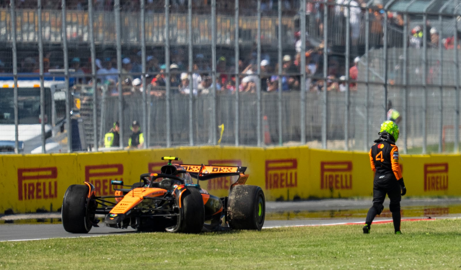 McLaren driver Lando Norris, of the United Kingdom, walks away from his car following a collision during Formula One auto racing action at the Canadian Grand Prix in Montreal, Sunday June 15, 2025. Christopher Katsarov/The Canadian Press via AP)