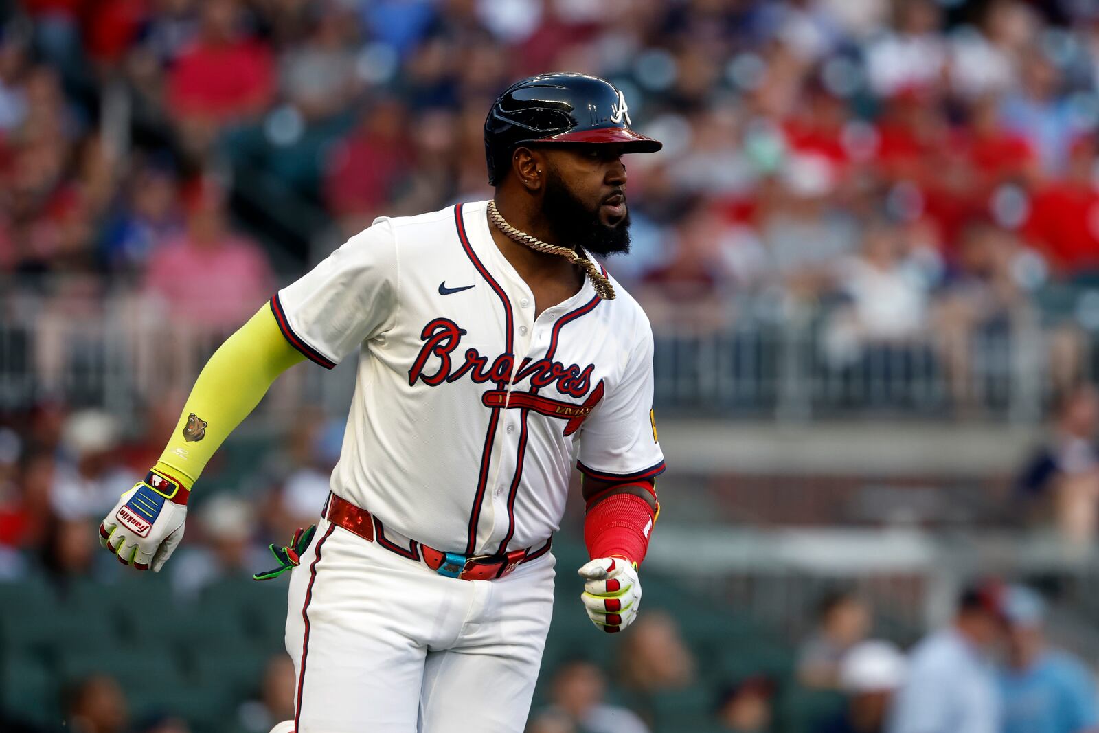 Atlanta Braves' Marcell Ozuna runs to first base on a single during the first inning of a baseball game against the Cincinnati Reds, Thursday, May 8, 2025, in Atlanta. (AP Photo/Butch Dill)