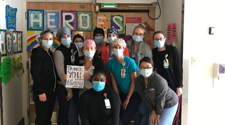 Kristen Leahy (far right, back row) pictured with her co-workers at Massachusetts General Hospital. CONTRIBUTED