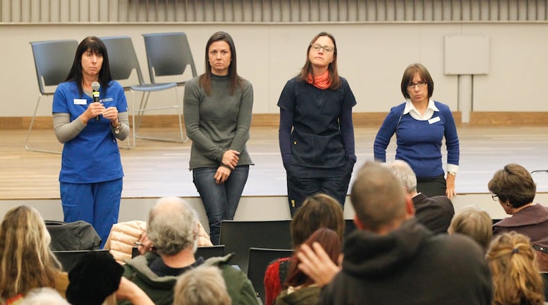A team reviewing the operations of the Montgomery County Animal Resource Center met with the public during a meeting in late November at the downtown Dayton Metro Library. The assessment team includes from left: Cameron Moore from the University of Florida; Dr. Kim Sanders, director of Anderson County (S.C.) PAWS; Dr. Becca Boronat of the Charleston (S.C.) Animal Society; and Dr. Sara Pizano, founder of Team Shelter USA. CHRIS STEWART / STAFF