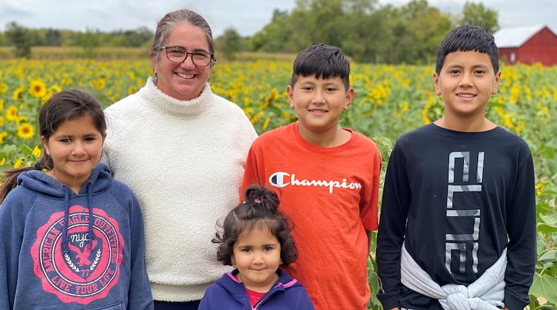 Susan Marticello, proud mother of two adult daughters, former military spouse of 25 years, has served the Miami Valley community in a variety of employed and volunteer roles for over 20 years, and now “Mama Susan,” proud American sponsor to a large family of Afghan refugees.  (CONTRIBUTED)
