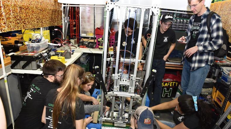 Participants in the Miami Valley FIRST Robotics Regional Competition fine tune their robot to compete in the FIRST POWER UP challenge at the Nutter Center March 2. FIRST POWER UP challenge is a partnership of students, teachers, administrators, parents, corporate mentors and community volunteers whose common goal is to create a challenging, hands-on environment that helps students grow into future engineers, scientists, inventors and business people. (U.S. Air Force photo/Michelle Gigante)