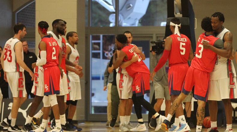 Red Scare guard Vee Sanford hugs Carmen’s Crew guard Aaron Craft after Carmen’s Crew won in the third round of The Basketball Tournament on Sunday, July 21, 2019, at Capital University in Bexley.
