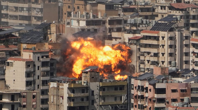 Flames rise from an Israeli airstrike in Dahiyeh, Beirut's southern suburbs, Wednesday, March 11, 2026. (AP Photo/Hassan Ammar)