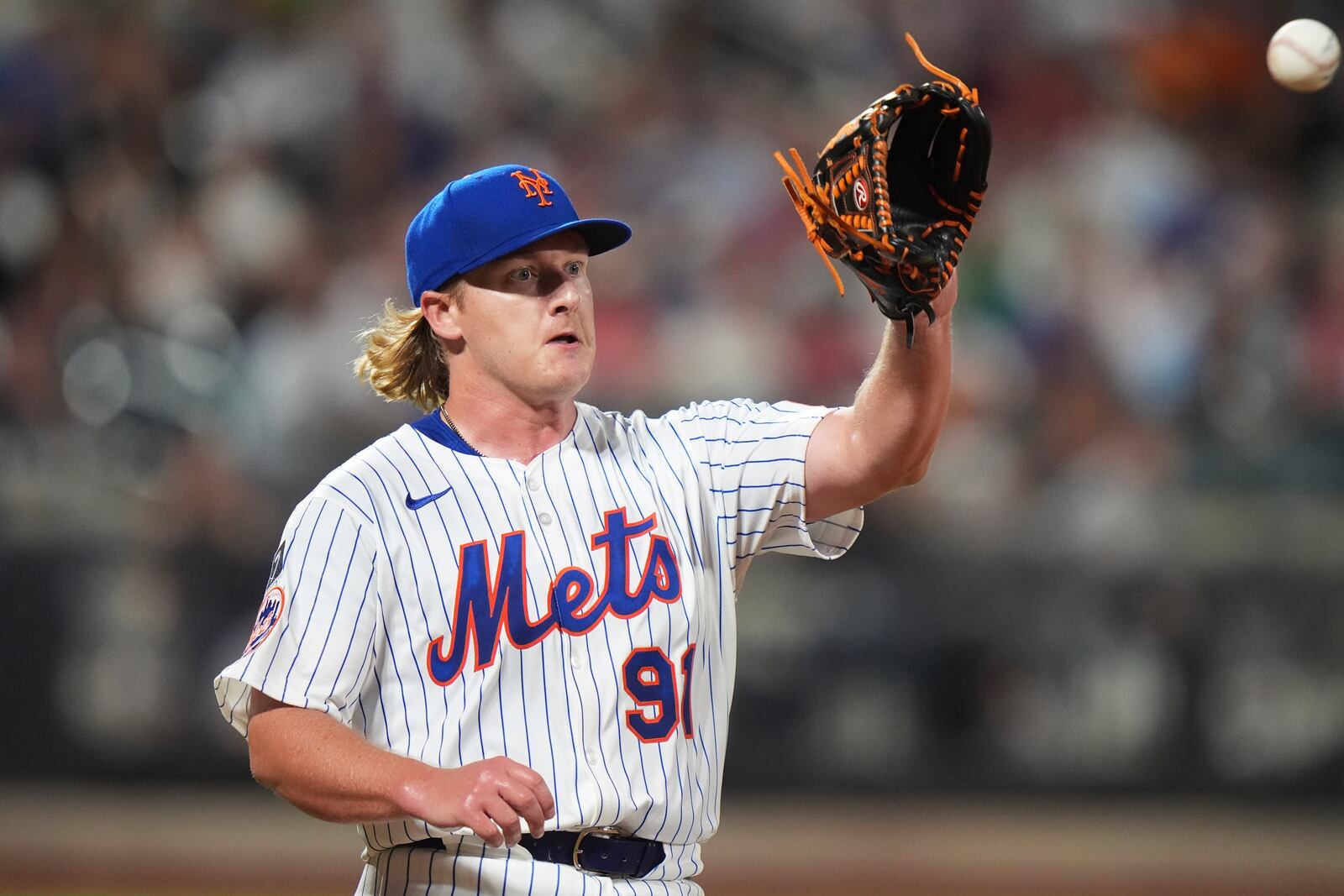New York Mets pitcher Jonathan Pintaro covers first base for an out during the ninth inning of a baseball game against the Atlanta Braves Wednesday, June 25, 2025, in New York. (AP Photo/Frank Franklin II)