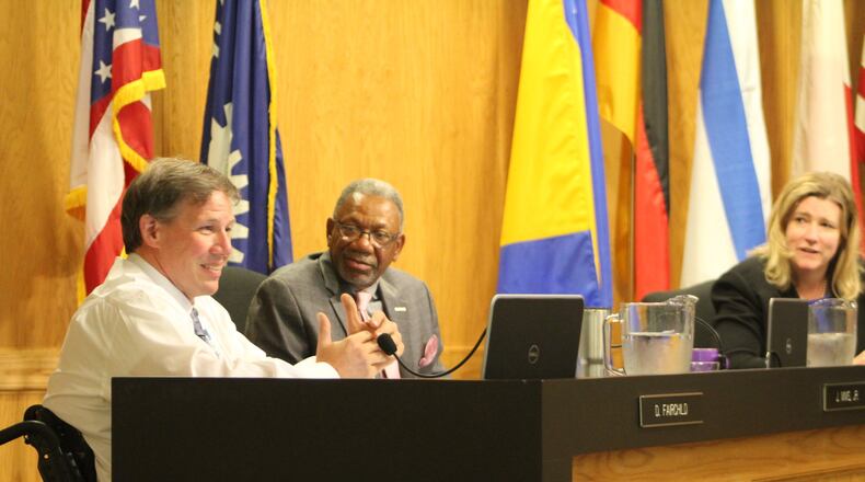 From left, Dayton city commissioners Darryl Fairchild, Jeff Mims Jr and Dayton Mayor Nan Whaley. CORNELIUS FROLIK / STAFF