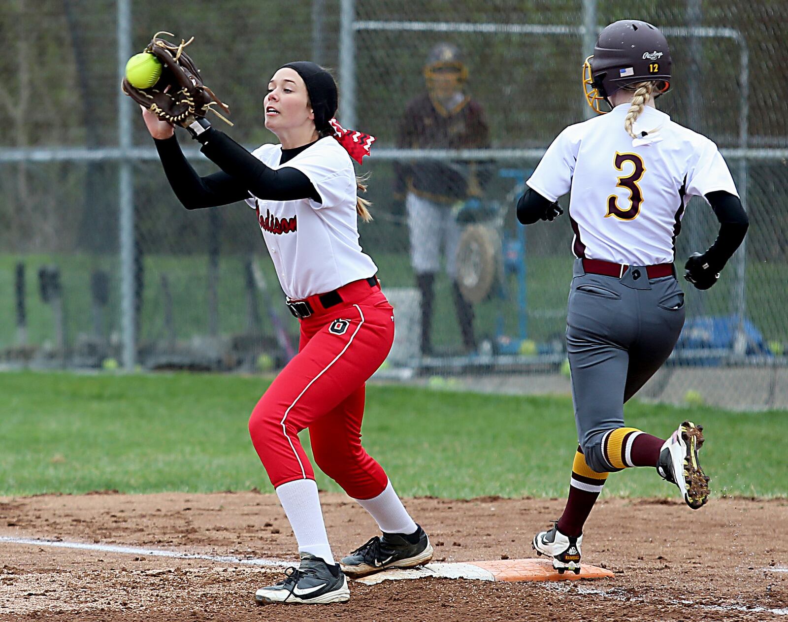 Maddy Foster of Ross beats the throw to Madison first baseman Sy Beachler on Saturday at Ross. CONTRIBUTED PHOTO BY E.L. HUBBARD